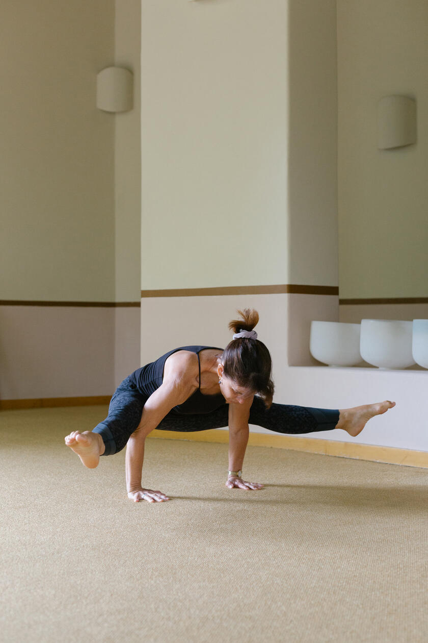 Woman doing yoga pose in studio