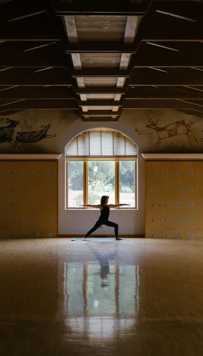 Woman doing yoga in a studio